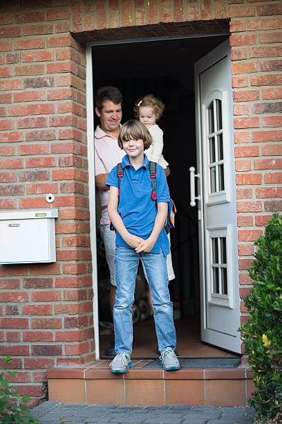 istock Boy leaving home for his first day back to school 478427039