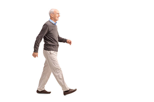 istock Casual senior man walking and smiling 478427416