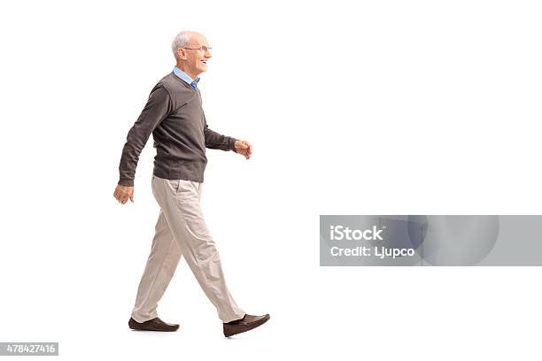 Casual Senior Man Walking And Smiling Stock Photo - Download Image Now - Walking, Senior Adult, Men