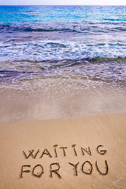 istock Waiting for you  written in a sandy tropical beach 478427713