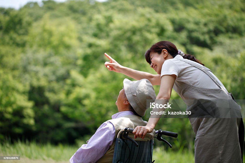 Care Helper Seniors and helpers in wheelchairs Assisted Living Stock Photo