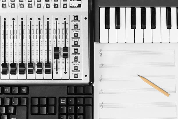 istock pencil on blank music sheet, studio mixer, piano & keyboard 478431144