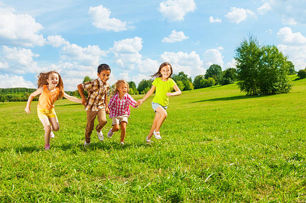 istock Kids running in the park together 478434613