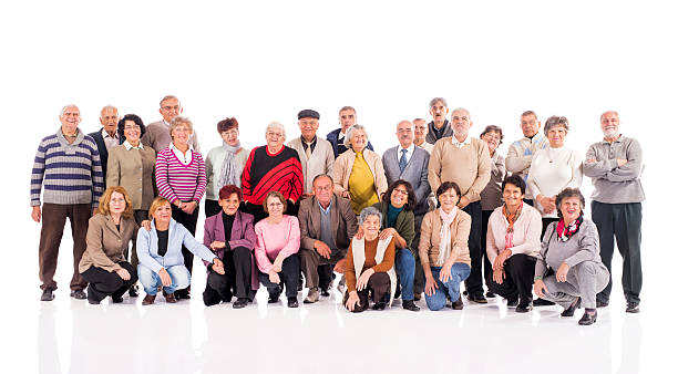 istock Large group of smiling old people looking at the camera. 478437048