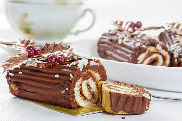 istock Chocolate roll with the decoration of leaves and berries 478437111