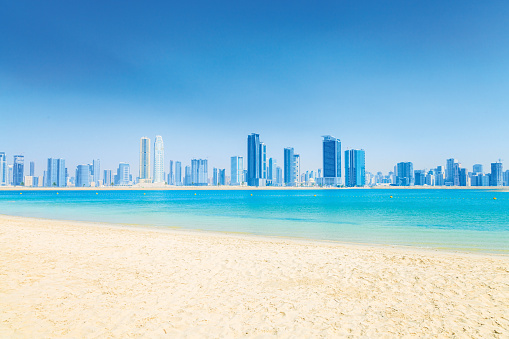 City view from Al Mamzar Beach Park in Dubai, UAE .Al Mamzar is located in the area of Deira, in the north-east of Dubai. The locality is bordered by the Persian Gulf to the north, Al Waheda to the west, Hor Al Anz to the south and the emirate of Sharjah to the east.