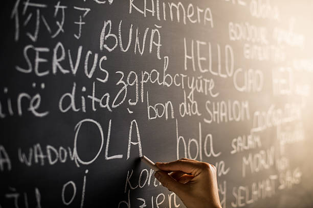 Hello in many languages Hello in many languages written with chalk on blackboard writing on chalk board stock pictures, royalty-free photos & images