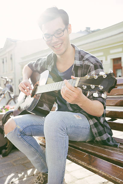 istock Guitar Player Singing Outdoors 478438704