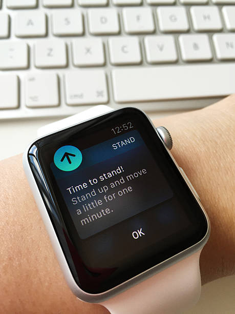Bucharest, Romania - June 23, 2015: Apple Watch Sport 42mm model showing on display the reminder to stand up and move. This is the first version of the Apple Watch and was released in 24 April 2015. 