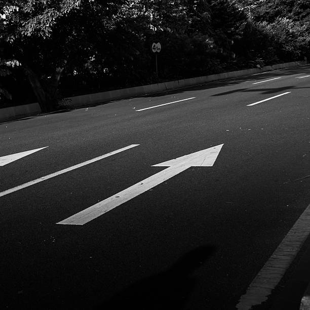 istock road with arrows sign 478441909