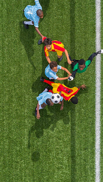 istock Young Boys Playing Football 478442141