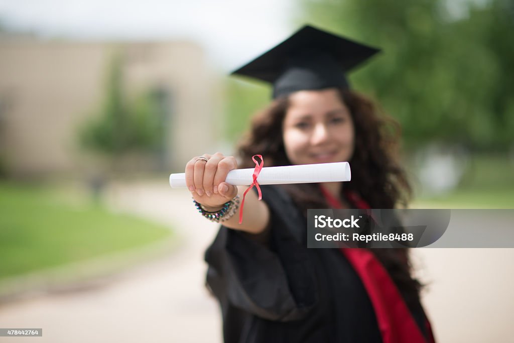 College grauduate Female college graduate celebrating 2015 Stock Photo