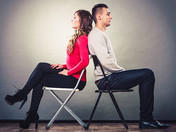 istock Young couple after quarrel sitting back to back 478443474