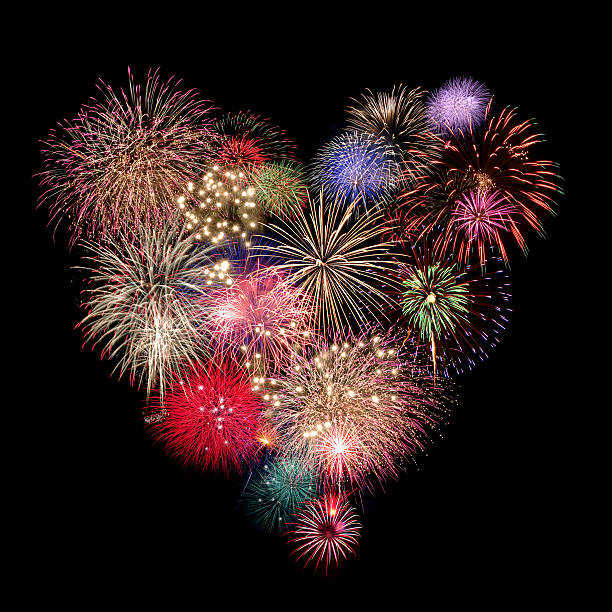 Heart Fireworks Celebration on black Background stock photo