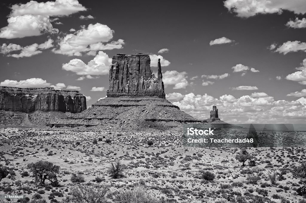 Monument Valley Black and white scene of Monument Valley in Utah.  Large rock formations called mittens are seen in the distance. 2015 Stock Photo