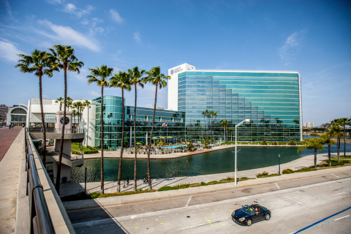 Long Beach, USA - May 4, 2013: Hyatt Regency Hotel,  Long Beach, California. People visible around the Hyatt pool.