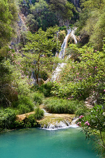 Natural waterfall and lake in Polilimnio area. Greece stock photo