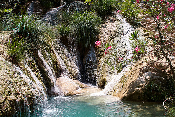 Natural waterfall and lake in Polilimnio area. Greece stock photo