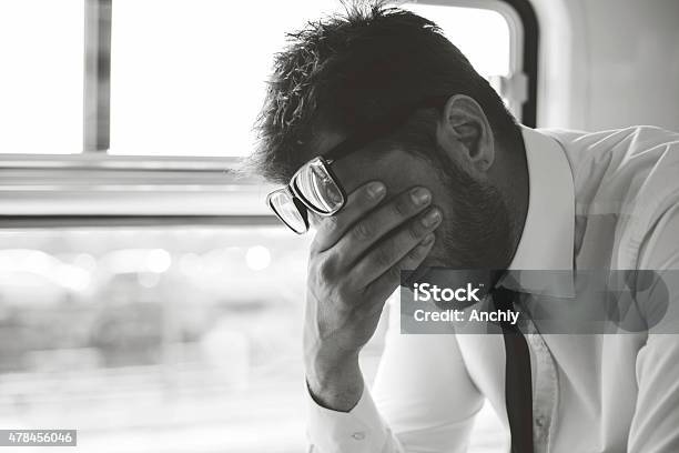 Depressed Business Man Traveling Home By Train Stock Photo - Download Image Now - Sadness, Business, Men