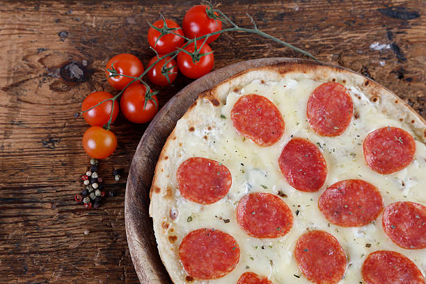 istock Pepperoni Pizza on Wood 478456110