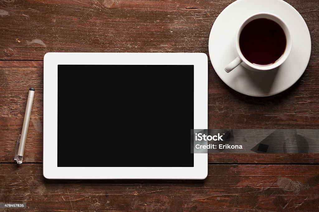 Digital tablet and coffee Digital tablet and coffee on wood table Blank Stock Photo