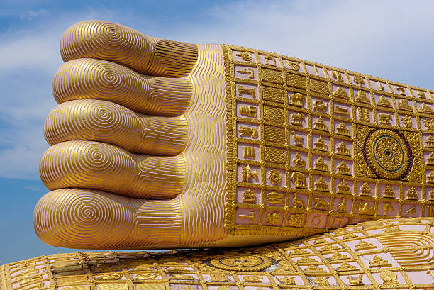 istock Foot print big statue of reclining buddha image 478458616