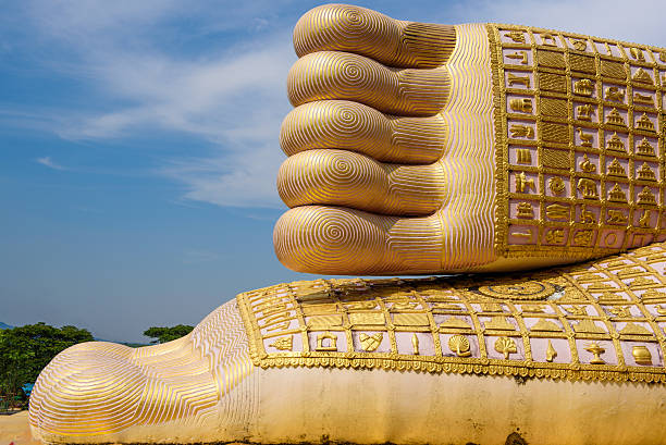 istock Foot print big statue of reclining buddha image 478458618
