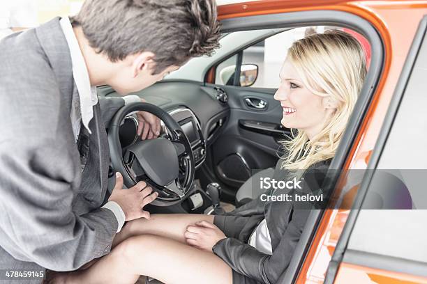 At The Car Dealership Stock Photo - Download Image Now - Adult, Assistance, Automobile Industry