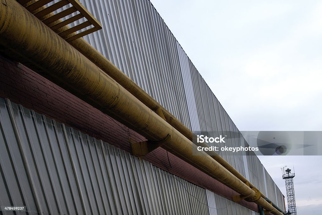 pipework Pipework on a metal factory wall. Abstract Stock Photo