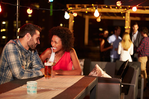 istock Couple at a rooftop party 478459268