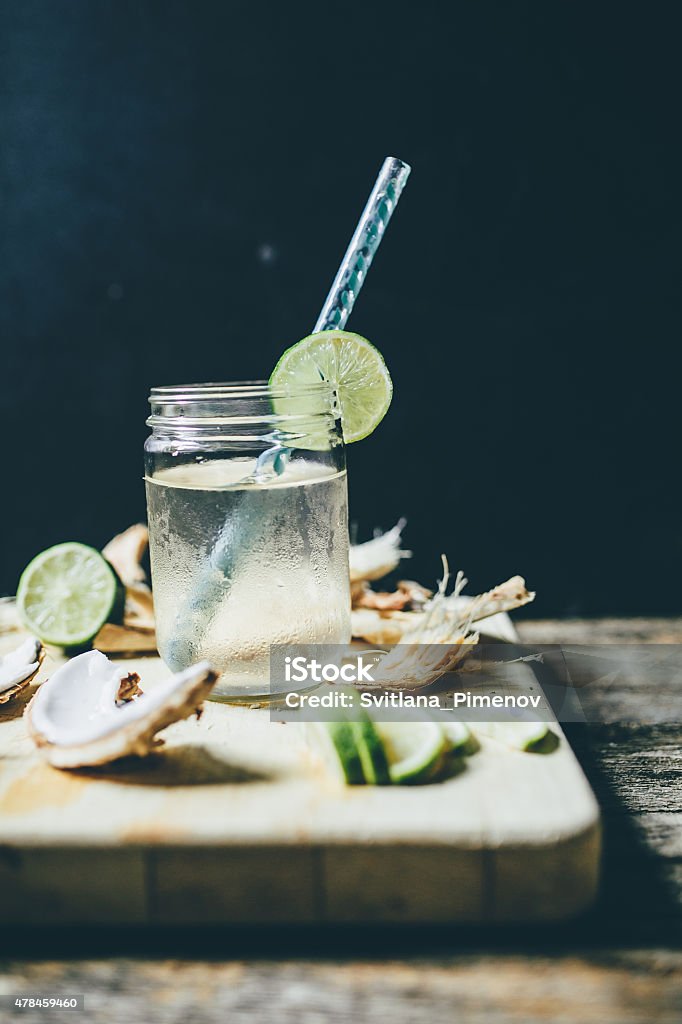 Coconut water with lime in a jar Chilled coconut water in a jar with sliced lime 2015 Stock Photo Coconut water with lime in a jar Chilled coconut water in a jar with sliced lime 2015 Stock Photo