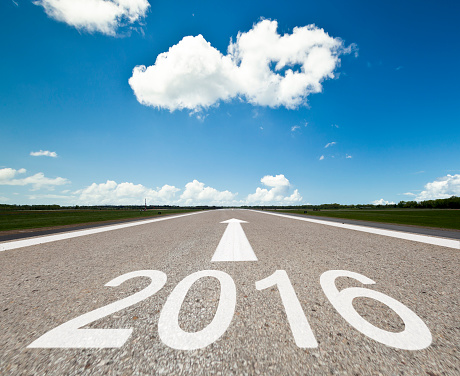 Empty road towards the big cloud and 2016 