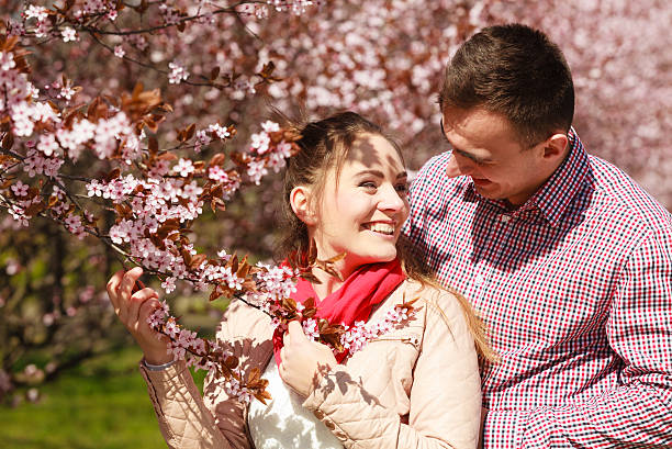 istock Couple in love walking in park at sunny spring day 478460258