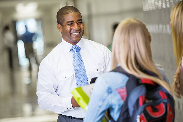 istock High school principal with student and parent 478461557