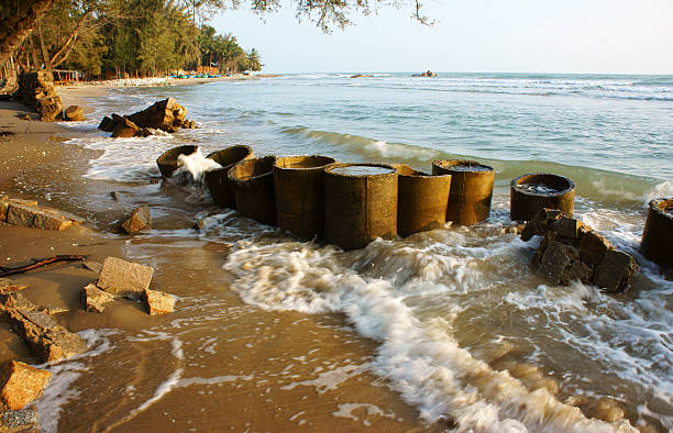 Erosion at seaside, wave destroy seawall, effect of climate change, this is global environment problem in future