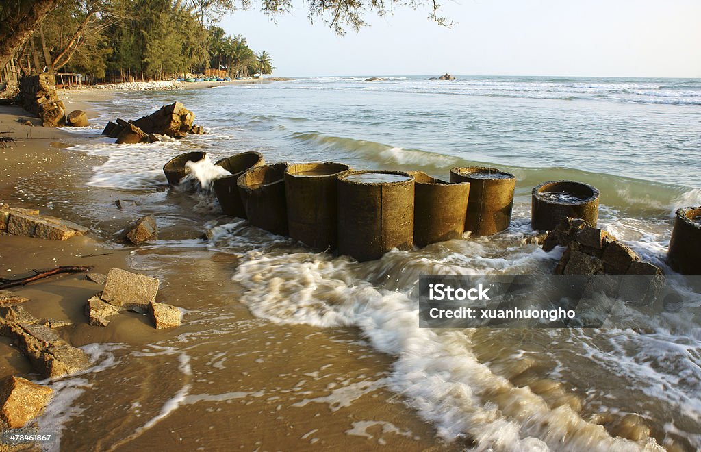 Erosion, wave destroy seawall, effect of climate change Erosion at seaside, wave destroy seawall, effect of climate change, this is global environment problem in future Demolished Stock Photo