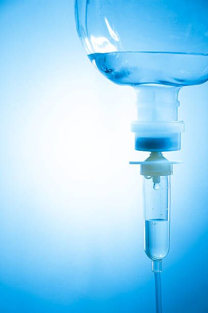 saline solution in vignette style saline solution in vignette style and blank area at left side saline drip stock pictures, royalty-free photos & images