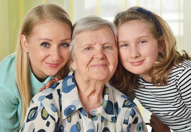 tres generaciones de mujeres. feliz familia. - women middle aging process covering fotografías e imágenes de stock