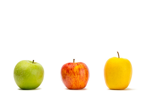 Three kind of commercial organic apples over white background