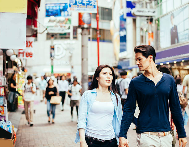 istock Young couple against cityscape background 478480670