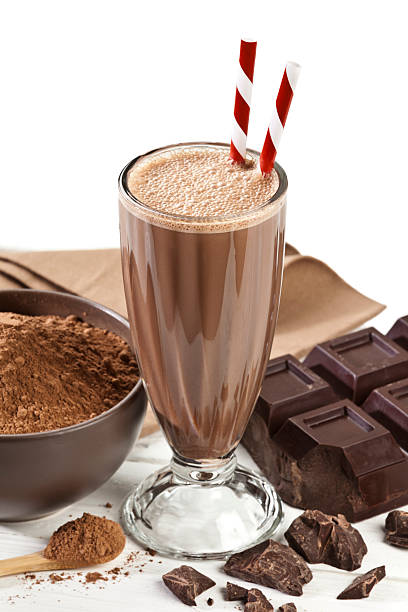 istock Chocolate Milkshake, cocoa and chocolate bar on white backdrop. 478481536