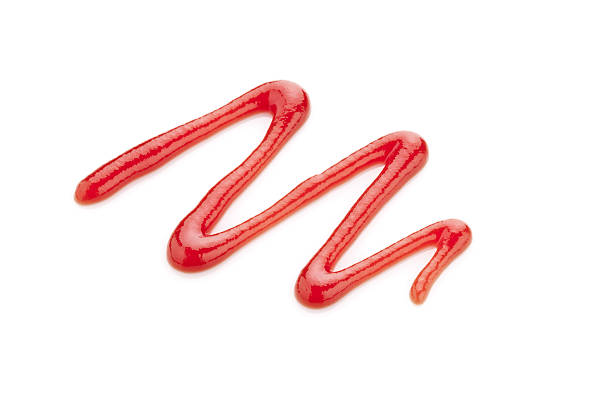 Ketchup zigzag line isolated on white background. DSRL studio photo taken with Canon EOS 5D Mk II and EF 100mm f/2.8L Macro IS USM