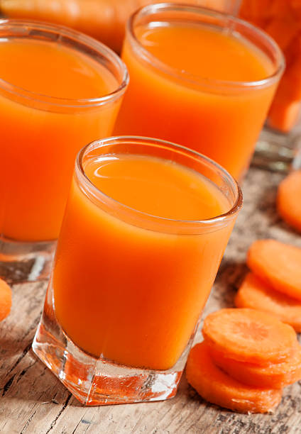 istock Fresh carrot juice in the glass 478484842