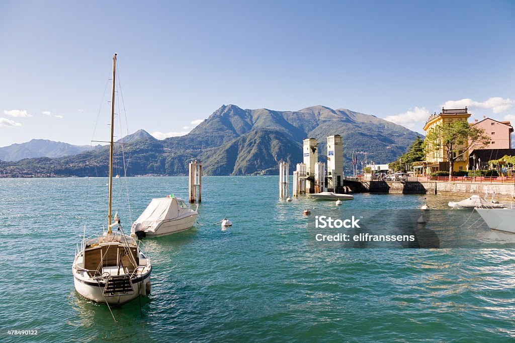 Varenna harbour, Como Lake, Italy The harbor of the village of Varenna with some boats in the water on the Como Lake in Lombardy, Italy 2015 Stock Photo