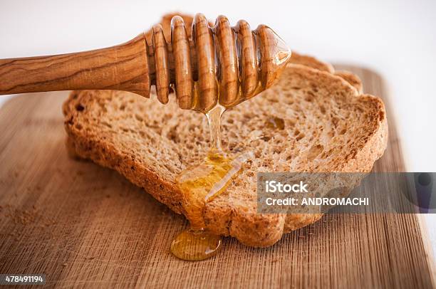 Toasted Bread With Honey And Honey Dipper Isolated In White Stock Photo - Download Image Now