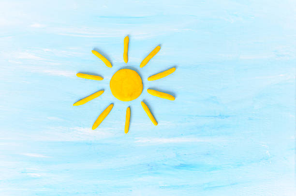 Sun on blue sku. Made from plasticine