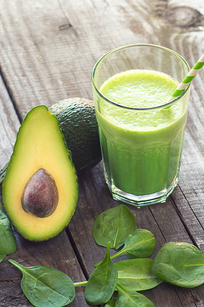 Avocado and baby spinach smoothie stock photo