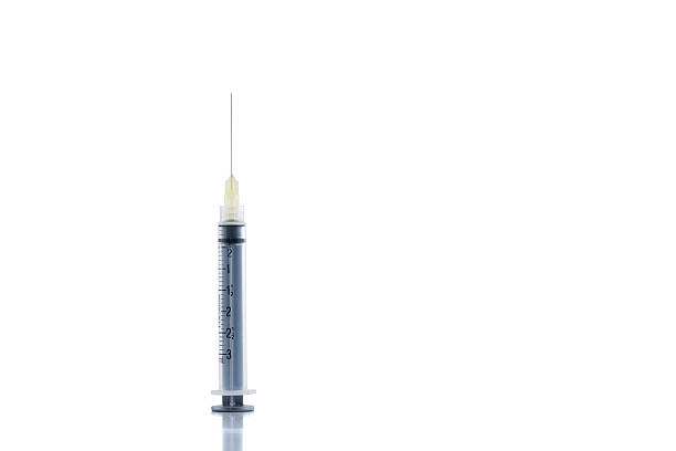 istock Medical or veterinary syringe with hypodermic needle attached 478494264