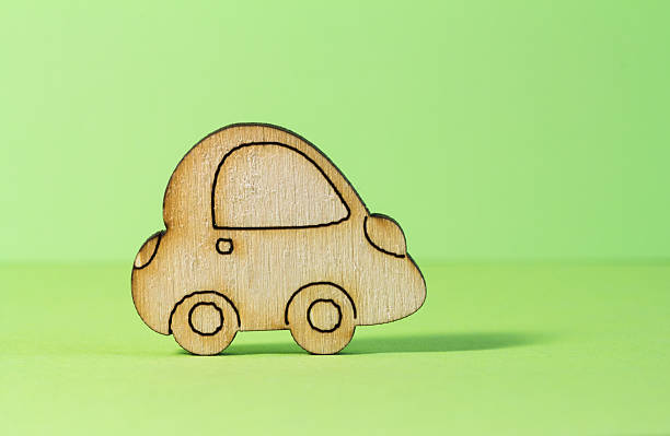 istock Wooden car icon on green background 478497814