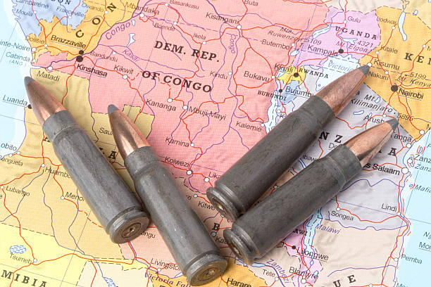 Bullets on the map of Democratic Republic of Congo Four bullets on the geographical map of Democratic Republic of the Congo. Conceptual image for war, conflict, violence. democratic republic of the congo stock pictures, royalty-free photos & images